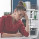 Women sitting at desk looking at her screen looking frustrated